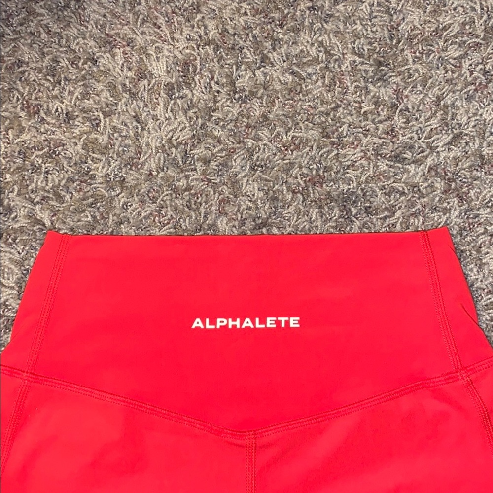 ALPHALETE RED SURFACE POCKET LEGGING